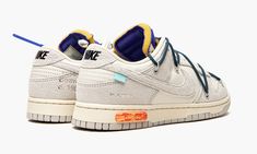 The Off-White x Nike Dunk Low “Lot 16” is one of several colorways of the lifestyle shoe created by Virgil Abloh and Nike from its “Lot 50” collaboration. The “Lot 50” campaign finds a total of 50 different arrangements of the retro basketball shoe, each with unique materials and embellishments. Here, on “Lot 16,” details include Sail leather on the perforated toe and on the mid-panel and Neutral Grey suede on the overlays and Swoosh. A grey suede Swoosh appears on both sides and black “Nike” br Nike Dunk Low Off White, Off White Dunk, Off White X Nike, Nike Off White, Retro Basketball Shoes, Nike Brand, Grey Suede, Virgil Abloh, Nike Dunk Low