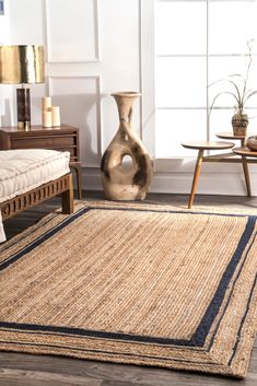 an area rug in the middle of a living room