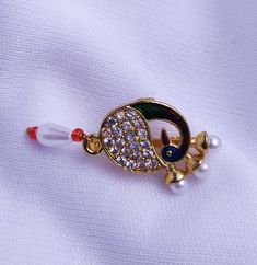 Plating : Gold Plated. No piercing required. This Nose Ring is perfect for gifting purpose for your loved ones. Peacock Colored Wedding Brooch Jewelry, Nose Ring Indian, Piercing Clip, Ring Indian, Indian Nose Ring, Nose Pin, Peacock Design, Nose Rings, Nose Ring Stud