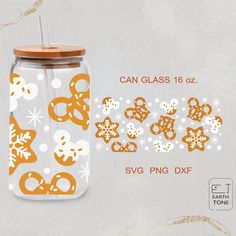 a glass jar with ginger cookies and snowflakes on it, next to a sticker that says can glass 16oz