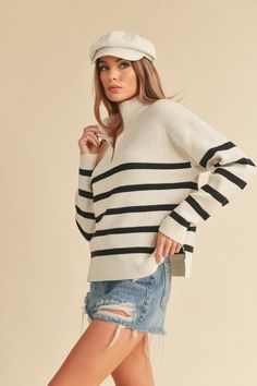 Wrap yourself in luxury with our soft knitted Daffie sweater. Designed with an oversized fit and high collar, this sweater exudes chic comfort. The neck features a trendy zipper, while the long sleeves and dropped shoulder seams add a touch of contemporary flair. Stay cozy and stylish all season long with this must-have wardrobe staple. Fabric Contents: 50% Viscose 28% Polyester 22% Nylon Stripy Tops, White Jumpsuit Dress, Pink Chiffon, Denim Accessories, Sweater Gift, Sweater Dress Midi, Outerwear Vest, Cardigan Top, Zip Sweater