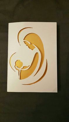 a paper cut out of the shape of a mother and child