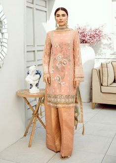 Peach Chiffon Dress Designer Peach Dress With Intricate Embroidery, Peach Dress With Intricate Embroidery For High Fashion, Designer Peach Dress With Resham Embroidery, Peach Semi-stitched Dress For Designer Wear, Elegant Orange Sharara With Sheer Dupatta, Peach Resham Embroidery Dress For Reception, Elegant Orange Sharara For Eid, Peach Reception Dress With Resham Embroidery, Peach Tailored Dress For Designer Wear