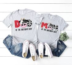 two t - shirts that say mom and daughter on the front, one with an image of a cow