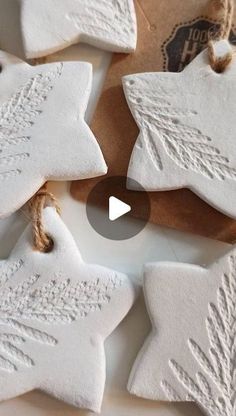 some white ornaments are sitting on a table