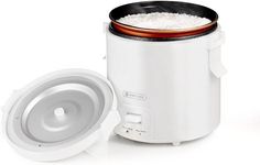 an electric rice cooker with its lid open next to it's bowl filled with rice