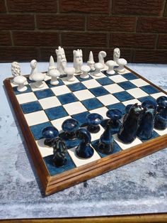 a chess board with blue and white pieces on it