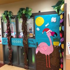 a classroom door decorated with paper machs and decorations for the flamingo themed school