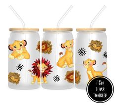 three glass tumblers with lion images on them