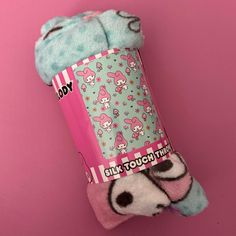 a pink and blue sock with hello kitty on it