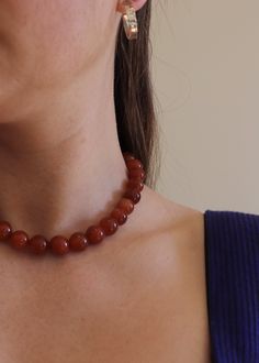 The Jude Necklace is made by hand in Adelaide, Australia. Made using natural carnelian beads with sterling silver findings. $10 of every item sold goes towards helping to rescue, protect and educate vulnerable children. Measurements: 12mm round beads Roughly 41cm in length Round Bead Necklace, Adelaide Australia, Carnelian Beads, Yoga Jewelry, Wine Bag, Summer 24, Stone Necklace, Round Beads, Statement Necklace