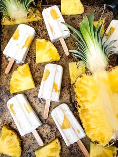 pineapple and coconut pops on a tray with text overlay that reads pina colada pops