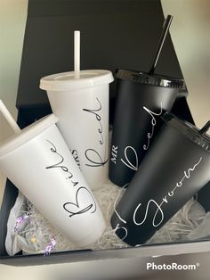 three cups with straws in a box on top of each other and the words i love you written on them