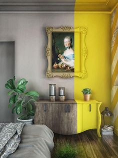 a bedroom with yellow and grey walls, a painting on the wall