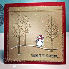 a christmas card with a snowman on the tree line and words thinking of you at christmas