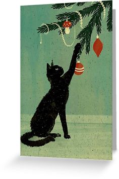 a black cat reaching up to a christmas ornament on a pine tree branch