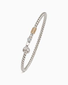 This sterling silver piece features an intertwined rope-inspired band, seven 14K gold good luck wraps, a faceted white zircon stone and a signature petroglyph clasp. Designed for stacking or to be worn on its own, the Twisted Hook Bracelet will elevate any look. Found in many of our designs, Vibe’s seven good luck wraps represent love, laughter, happiness, good fortune, health, unity, and peace. Metal: Sterling silver with 14K gold wraps Stone: White zircon Band Width: 3mm Petroglyph: 6mm x 5mm Sterling Silver Symbolic Jewelry For Good Luck, Symbolic Sterling Silver Jewelry For Good Luck, Luxury Classic Sterling Silver Braided Bracelet, Spiritual Silver Hand-strung Braided Bracelets, Nickel-free Sterling Silver Spiritual Bracelet, Bracelet With Stone, Hook Bracelet, Gold Wrap, Gold Piece