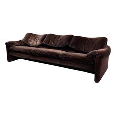 a brown couch sitting on top of a white floor