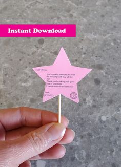 a hand holding a pink stick with a star on it and the words instant download