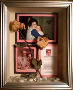 an image of two people in a frame with flowers and rocks on the ground next to them