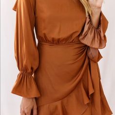 Flowy Camel Colored Wrap Dress. Open Back For Flirty Fun! Chic Brown Mini Dress With Ruffles, Spring Camel Dress, Brown Ruffled Dress For Date Night, Chic Brown Dress For Brunch, Brown Ruffled Dress For Day Out, Chic Brown Mini Dress For Brunch, Brown Long Sleeve Dresses For Brunch, Brown Long Sleeve Dress For Brunch, Brown Mini Dress For Spring Date Night