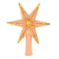 a pink and gold christmas tree topper with a star design on the front, standing upright