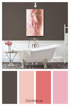 a bathroom with pink and brown walls, white bathtub, and wooden flooring