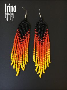 Fire red fringe earrings Black beaded earrings Gradient long seed bead earrings Chandelier orange earrings Fire boho jewelry Dangle earrings Very lightweight. Original design. Measurements: Length - 4 inches (9 cm) Width - 0.8 inches (2,5 сm) Materials: 925 sterling silver hooks Czech glass beads Nylon Thread Patience and Creativity 100% handmade. Shipping worldwide .. ready to be given away ! Thanks for view! I accept Paypal. Add to cart to confirm order now. Should not make contact with water, Orange Beaded Fringe Drop Earrings, Orange Beaded Fringe Dangle Earrings, Orange Fringe Dangle Earrings, Orange Fringe Jewelry For Festivals, Orange Tassel Jewelry With Round Beads, Long Seed Bead Earrings, Black Beaded Earrings, Peacock Feather Earrings, Bead Earring