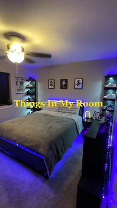 a bed room with a neatly made bed and blue lights on the ceiling above it