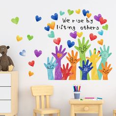 children's room wall decals with colorful handprints on the wall and we are by lifting others up