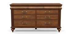 a wooden dresser with four drawers and two pulls on the top drawer, against a white background