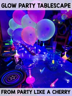 glow party tablescape with balloons and confetti