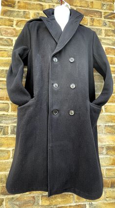 KINGLOUIEVINTAGE   Quality Vintage & British made clothing DESCRIPTION = Vintage 1970's Original pure wool military/seaman long navy blue overcoat. Large notched collar with six button double breast front opening. Two front flapped pockets, single rear vent and buttoned epaulets.  BRAND = Unbranded SIZE (UK) = 42 CONDITION :- = Excellent  MEASURMENTS (Inches) = ARMPIT - ARMPIT :- 21" COLLAR - HEM :- 42" ARMPIT - CUFF :- 18.5" WAIST (Laid flat) :- N/A (Overall) :- N/A INSIDE LEG:- N/A NOTE:- Plea Long Wool Pea Coat With Pockets, Military Style Fitted Wool Pea Coat, Fitted Military Wool Pea Coat, Military Style Peacoat For Workwear In Winter, Navy Uniform Style Winter Outerwear, Long Wool Pea Coat With Buttons, Fitted Long Wool Pea Coat, Long Peacoat With Pockets, Black Long Peacoat With Pockets