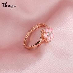 Capture the essence of cherry blossom season with our Silver Sakura Spinner Ring. This elegant piece tells a story of beauty and renewal, as delicate petals bloom and dance in the breeze. The spinner design allows for a soothing sensation, perfect for those seeking balance and serenity in their daily lives. Elevate your style with this stunning symbol of hope and new beginnings.   - Brand: Thaya  - Material: S925 Silver  - Weight : About 2.34g  - Size: Stack Mouth 14th  - Style: Flower  - Gender: Women Spring Wedding Rose Gold Jewelry, Spring Wedding Jewelry With Petal Design, Spring Rose Gold Flower Jewelry, Dainty Jewelry For Spring Anniversary, Dainty Jewelry For Anniversary In Spring, Dainty Spring Jewelry For Anniversary, Rose Gold Jewelry For Anniversary In Spring, Rose Gold Flower Shaped Jewelry For Spring, Rose Gold Jewelry For Spring Anniversary