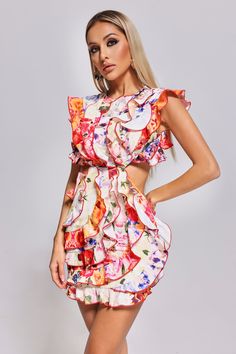 The Unyque Cutout Flounced Printed Mini Dress is a delightful blend of fashion-forward design and playful elegance. With its eye-catching print and flirty flounced hem, it's a celebration of individual style. The strategically placed cutouts add an alluring touch while maintaining a sense of chic sophistication. Pair the Unyque Cutout Flounced Printed Mini Dress with strappy sandals, espadrilles, or ankle boots for a relaxed and stylish look.  Fabric composition: 95% polyester, 5% spandex  Washing method: gently hand wash or dry clean or machine wash   Model wearing size S  Model Stats:Height - 68.5"/174cm Bust - 35"/89cm Hips -37.4"/95cm Waist- 25.2"/64cm  Colour may vary due to lighting on images.  Item runs true to the size chart and is cut to suit our size chart. Please refer to our si Stylish Clothes For Women, Printed Dress, Party Looks, Printed Mini Dress, Individual Style, Strappy Sandals, S Models, New Outfits, Stylish Women