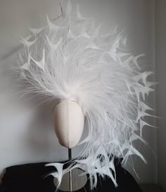 "Stunning headpiece made of White peacock butterfly feathers seated on a silver metal headband. I custom made this headpiece for Lady Gaga for her Las Vegas residency. White peacock butterfly feathers are very rare and stunning! Headpiece has 60 butterflies from 8\" to 14\" long, each feather is bended to create a swirl shape. Only one available, please allow two weeks to have this made. feel free to ask any question. Thank you." Peacock Facinators, Paper Headpiece, Peacock Headpiece, White Headpiece, Blush Pink Fascinator, Statement Headpiece, Silver Headpiece, Unusual Hats, Headband Design