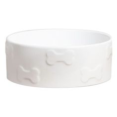 a white bowl that has a dog bone design on the front and side of it