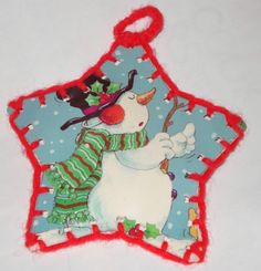 an ornament with a snowman on it