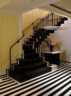 a black and white striped floor with stairs