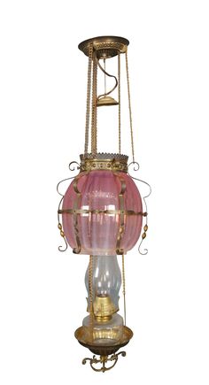 an old fashioned light hanging from the ceiling