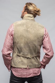 An alpine-inspired waistcoat that blends luxury and classic styling. The Trapp vest made by Meindl, German makers of fine leather goods since 1683, is crafted from a robust red deerskin that has been meticulously tanned using a process dating back thousands of years. The transformation from the rawhide to a finished jacket takes over three months with great care, skill, and experience applied at every stage. The Trapp, done in a vintaged beige with a slightly distressed look, is guaranteed to ge Travel Jacket, Collar Vest, Mac Jeans, Knit Outerwear, Mens Vests, Selvedge Denim, Sport Dress, Deer Skin, Tailored Jacket