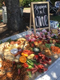 an assortment of fruits and vegetables on a table with a sign that says spring is time