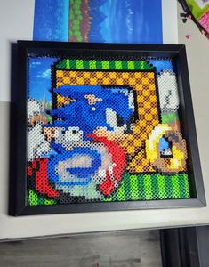 this is an image of a cross - stitch picture frame with sonic and friends on it