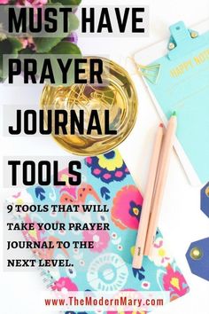 a desk with flowers, notebook and pen on it that says must have prayer journal tools