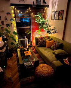 a living room filled with furniture and lots of lights on the wall above it's fireplace