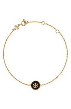 A polished Tory Burch logo set in a lacquered charm brings signature sophistication to a delicate chain bracelet. 8"length, 1 1/2" extender 1/2" Squared (Pendant) 18k-gold plate/acrylic/moonstone Imported Elegant Black Jewelry With Gold-tone Logo Plaque, Classic Black Jewelry With Logo Charm, Tory Burch Kira, Logo Set, Square Pendant, Delicate Chain, Gold Black, Womens Jewelry Bracelets, Chain Bracelet