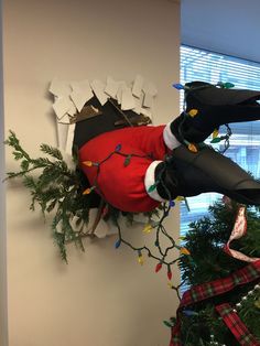 a decorated christmas tree in an office cubicle