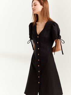 "MONICA is a knee length linen button down dress. DETAILS - Center front buttons - V neck - Knee length - Fitted bodice - No pockets - Oeko-Tex certified 100% lightweight linen - Cut and sewn to order just for you in our studio COLOR - Black, you can also choose other colors above - Fabric samples are available here https://www.etsy.com/listing/586569696/linen-fabric-samples SIZING & FIT - Fits true to size - Length (shoulder to hem) is approximately 39 inches / 99 cm - Bust approximately 33 Fitted V-neck Linen Dress With Buttons, Linen Dresses With Buttons For A Day Out, Spring Workwear Linen Dress With Buttons, Chic Linen Button-up Dress, Chic Linen Dress With Button Closure For Day Out, Day Out Button-up Linen Dress, Linen Mini Dress With Buttons, Buttoned Linen Mini Dress, Fitted Linen Dress With Buttons