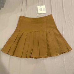 Nwt Waist:25.2", Length:14.4" Brown Fitted Mini Pleated Skirt, Fitted Brown Pleated Tennis Skirt, Trendy Brown Pleated Skort, High Waist Fitted Brown Skort, Trendy Brown Skirted Bottoms, Trendy Pleated Brown Bottoms, Brown Stretch Pleated Bottoms, Stretch Brown Pleated Bottoms, Casual Brown Pleated Skort