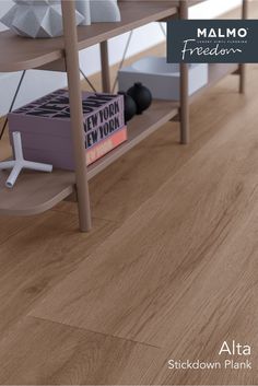 a book shelf with books on it and an advertisement for the new flooring product